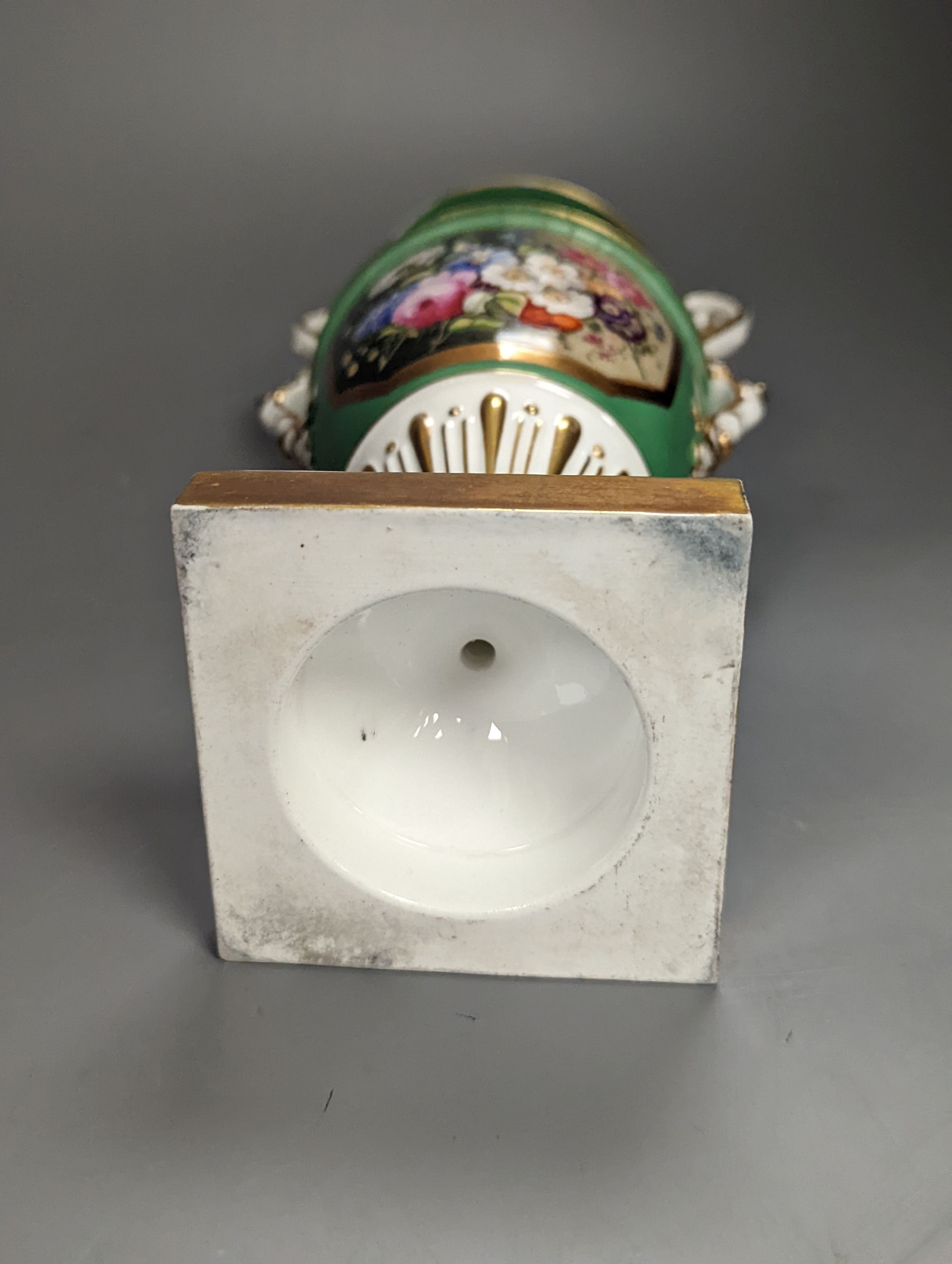 An English porcelain two handled vase painted with flowers in a panel on a green ground, probably Grainger Worcester, c.1830, height 24cm